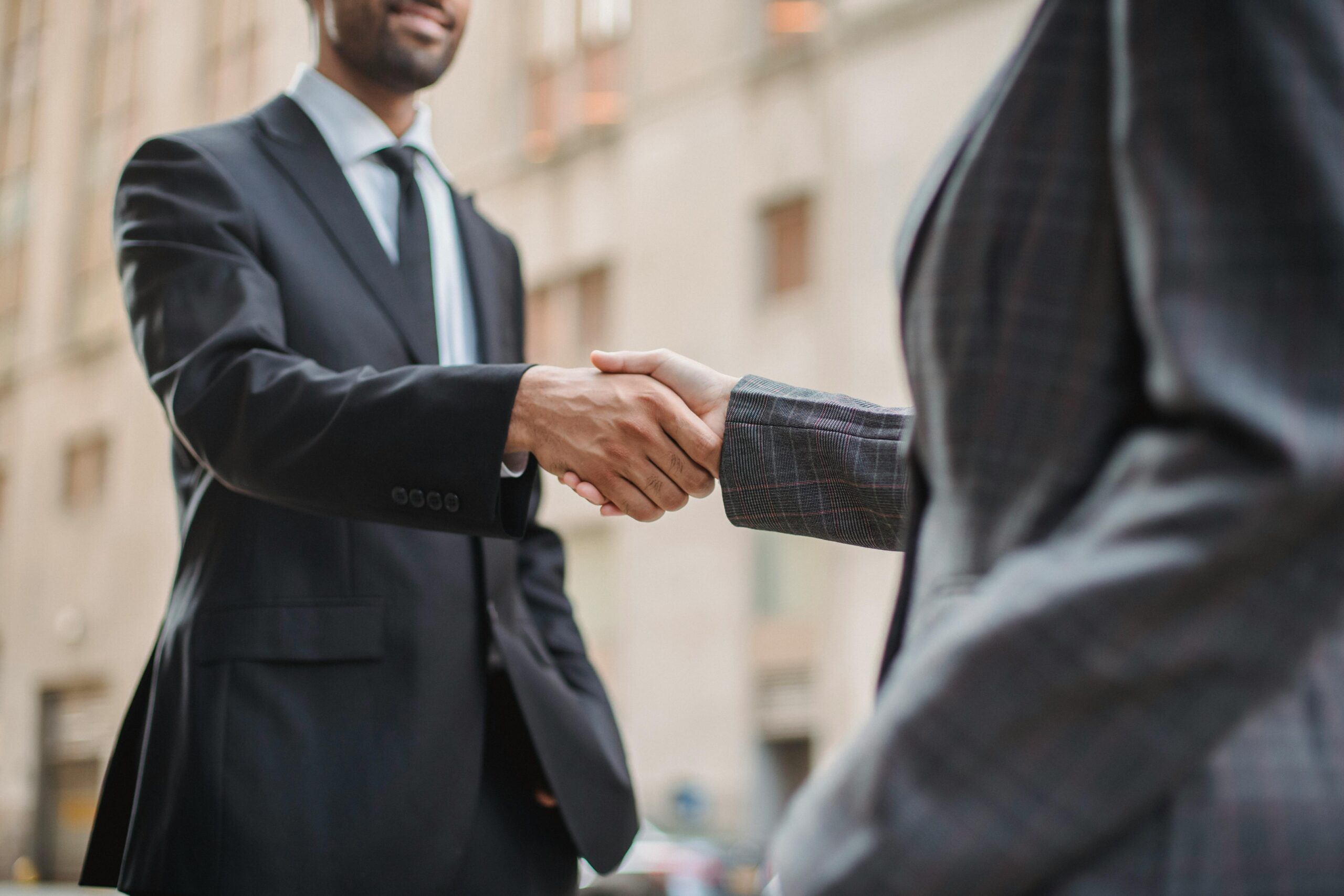 two-men-companies-shake-hands-for-saudi-arabia-business-consulting-agreement-EPS-Support